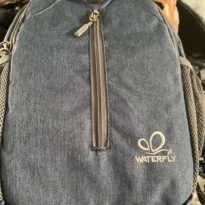 Stylish Blue Backpack with Textured Fabric and Vertical Zipper